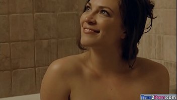 Hot brunette woman Lily Love is in the bathroom enjoying the bathtub