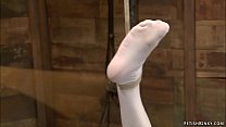 Busty ginger lesbian slave Audrey Hollander is tied and feet in socks and legs caned then mistress Claire Adams vibrates her in hogtie